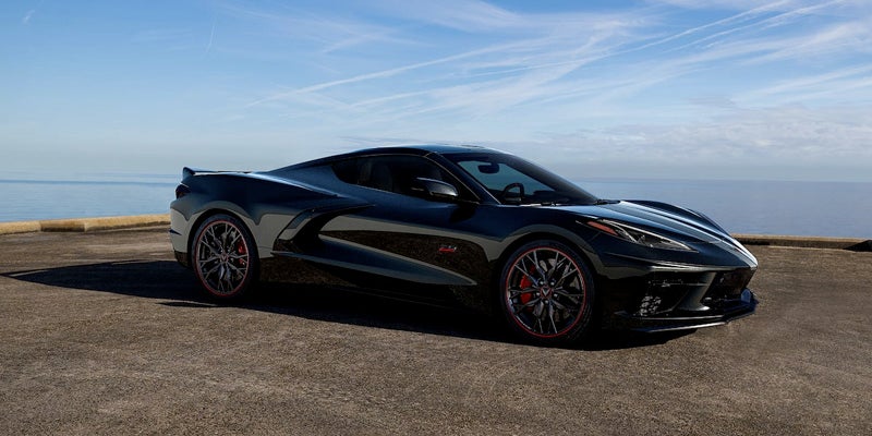 2023 Chevrolet Stingray parked on pavement with water in the background