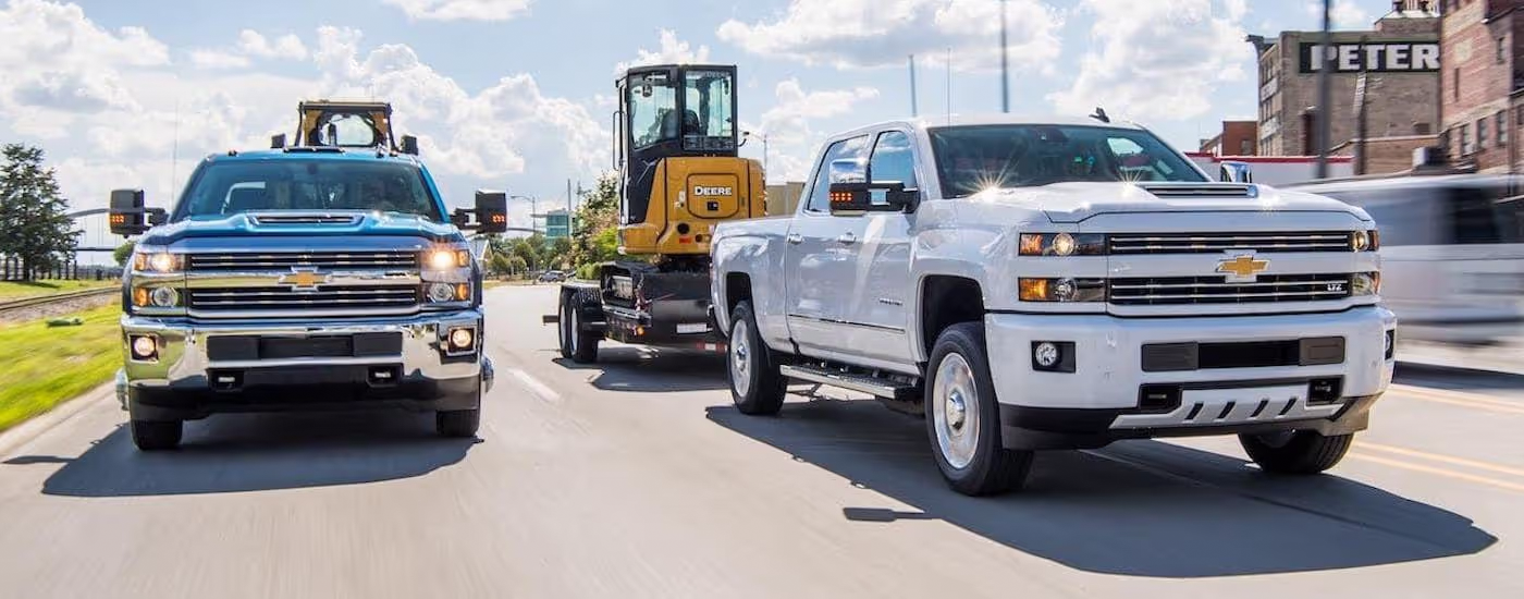 Silverado HD trucks driving on roadway